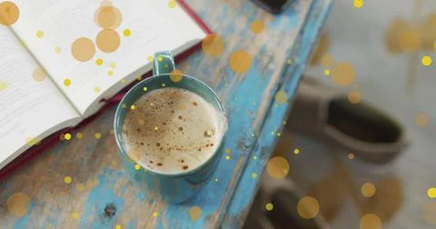 Image of falling yellow dots over coffee Stock Photos