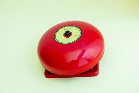 The image features a close-up, front-facing view of a circular, bright red .. Foto stock