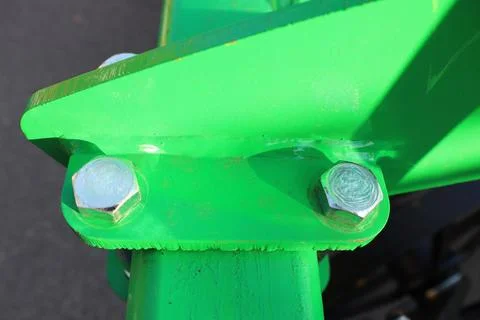 This image features a CloseUp of an intricately designed Green Metal Bolt Stock Photos