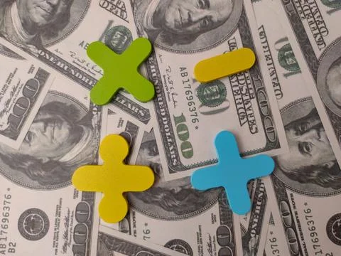 The image features colorful mathematical operation symbols set against a ba.. Stock Photos