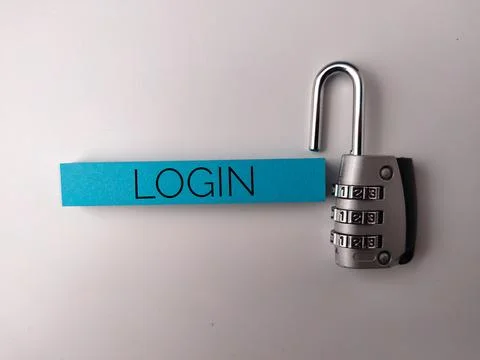 The image features a combination padlock next to a blue strip of paper with.. Foto stock