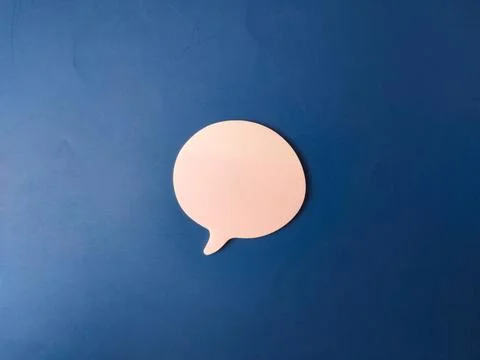 The image features a single, light pink speech or chat bubble set against a.. Stock Photos