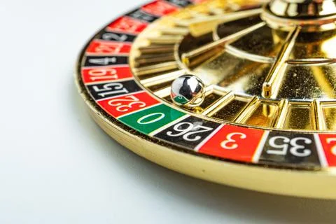 Image features a spinning roulette wheel, with a blurred metal ball, number.. Stock Photos