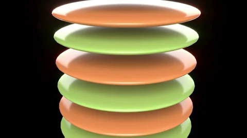 The image features a vertical stack of glossy disc shaped objects on black bg Stock Footage 316896821