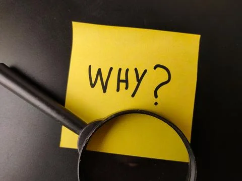 This image features a yellow sticky note with the word WHY?written on it in.. Stock Photos