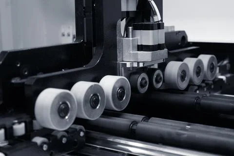 The image of the feed rollers of a woodworking machine. Stock Photos