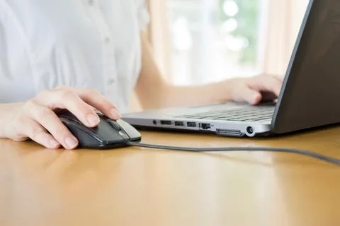Image of female hands clicking computer mouse Stock Photos