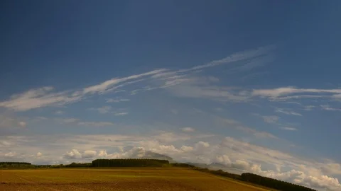 Image of field and bright blue sky; timelapse Stock Footage 89673520