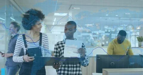 Image of financial code data over diverse female coworkers talking in office Foto stock