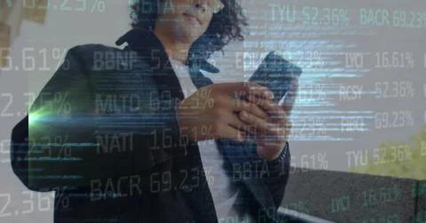 Image of financial data and code over biracial man using smartphone Stock-Fotos