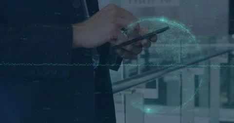 Image of financial data and globe over hands of caucasian businessman using Stock Photos