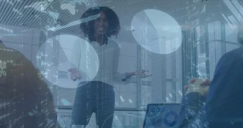 Image of financial data and graphs over african american businesswoman making Stock Photos