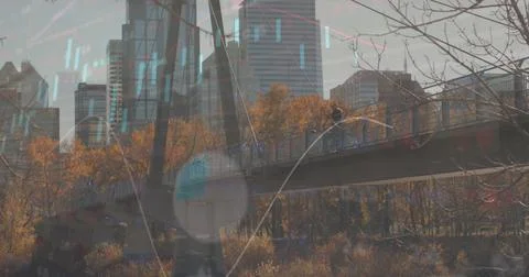 Image of financial data and graphs over cityscape Foto stock