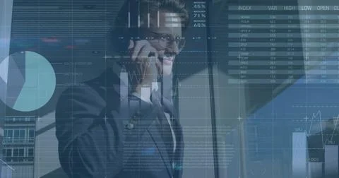 Image of financial data and graphs over caucasian businessman using smartphone Foto stock