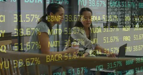Image of financial data and graphs over diverse female coworkers in office Stock Photos
