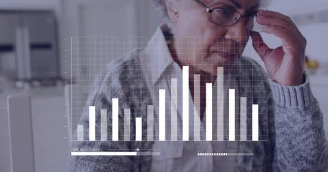 Image of financial data over senior biracial woman using laptop Foto stock