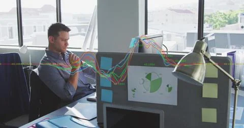 Image of financial data processing against thoughtful caucasian man sitting at 스톡 사진