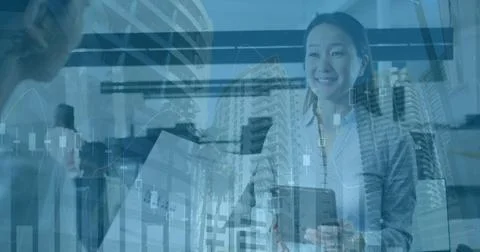 Image of financial data processing and cityscape over diverse business people in 写真素材