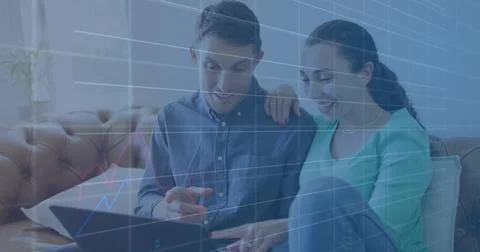 Image of financial data processing and statistics over caucasian couple Foto stock