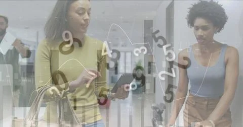 Image of financial data processing with numbers over diverse business people Stock Photos