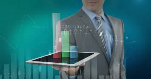 Image of financial data processing over businessman using tablet 写真素材