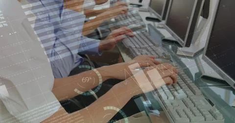 Image of financial data processing over diverse business people using computers Stock Photos
