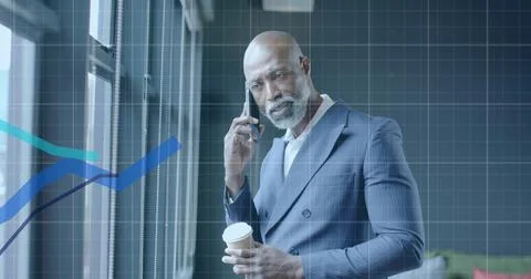 Image of financial data processing over african american businessman in office 写真素材