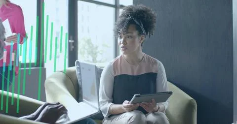 Image of financial data processing over diverse business people in office Stock Photos
