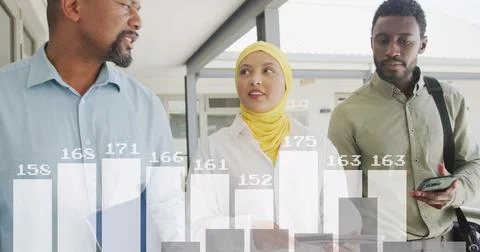 Image of financial data processing over diverse business people in office Stockfoto's