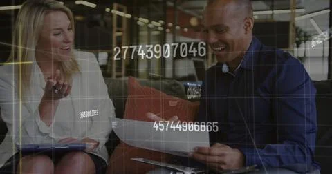 Image of financial data processing over diverse business people in office Stock Photos