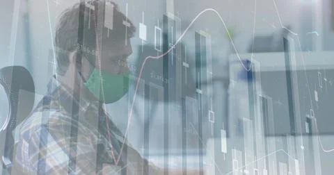Image of financial data processing over man in office wearing face mask Stock Photos