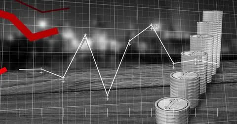 Image of financial data processing over stacks of silver coins 库存照片
