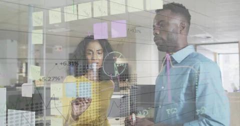 Image of financial data processing over diverse business people in office Foto stock