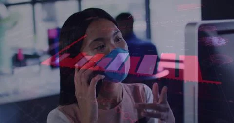Image of financial data processing over asian businesswoman with face mask in Foto stock