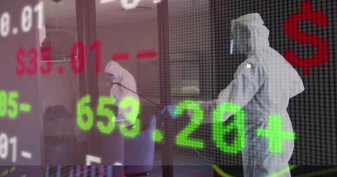 Image of financial data processing over people wearing safety suits disinfecting Foto stock
