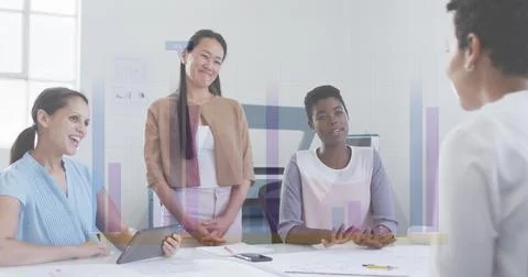 Image of financial data processing over diverse business people Foto stock