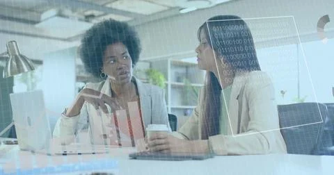 Image of financial data processing over diverse businesswomen in office 库存照片