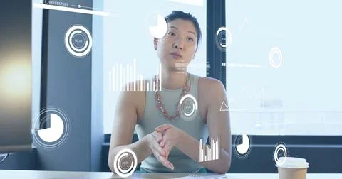 Image of financial data processing over asian businesswoman working in office Stock Photos