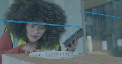 Image of financial data processing over biracial woman checking 3d model in Stock Photos