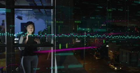 Image of financial data processing over asian businesswoman working in office Stockfoto's