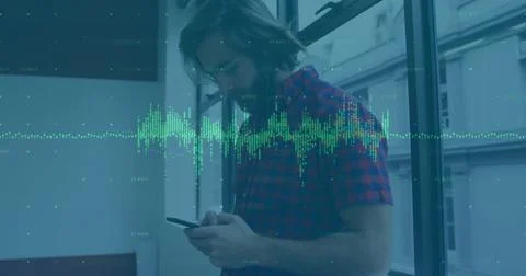 Image of financial data processing over caucasian businessman using smartphone 写真素材