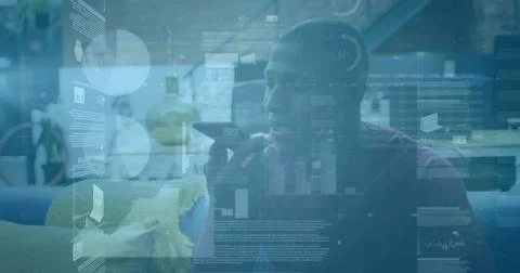 Image of financial data processing over african american businessman using Foto stock