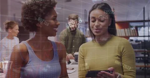 Image of financial data processing over diverse business people working at Foto stock