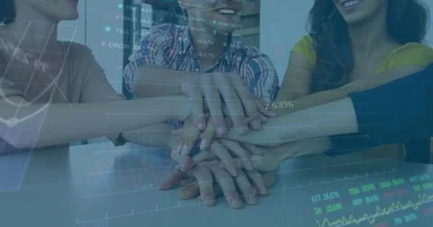 Image of financial data processing over office colleagues stacking hands 库存照片