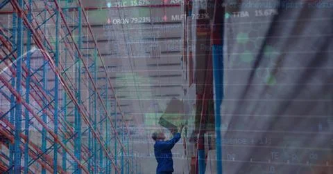Image of financial data processing over caucasian man in warehouse Stock Photos