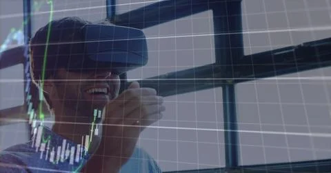 Image of financial data processing over businessman using vr headset Foto stock