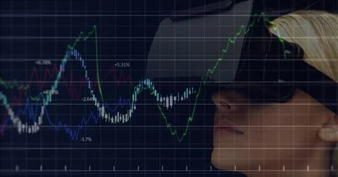Image of financial data processing over caucasian businesswoman wearing vr 写真素材