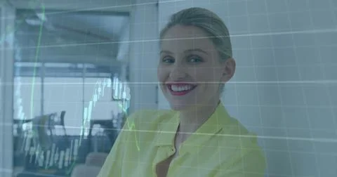 Image of financial data processing over caucasian businesswoman in office Stock Photos