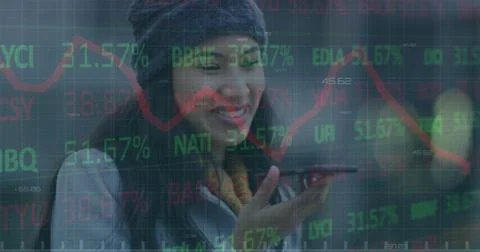 Image of financial data processing over businesswoman using smartphone 写真素材