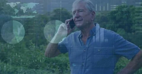 Image of financial data processing over caucasian man using smartphone Stock Photos